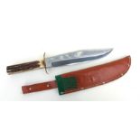 A Bowie knife with stag horn grips. An Edge Brand 447 knife of Solingen West Germany in its original