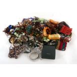 A large quantity of costume jewellery to include bangles and necklaces.