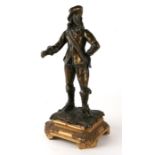 A bronze figure of King Charles I on an associated giltwood plinth, overall 39cms high.