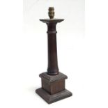 An oak table lamp with turned column on a square base, 47cms high.