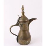 A Turkish / Islamic brass dallah coffee pot, 31cms high.