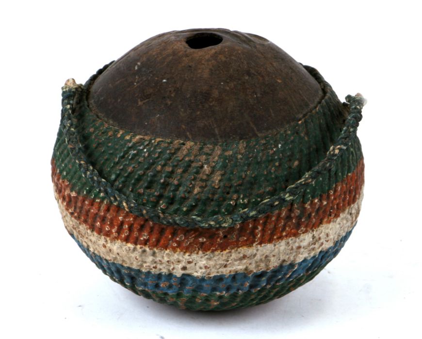 A 19th century coconut 'Bugbear' style flask with painted woven decoration, 13cms high.