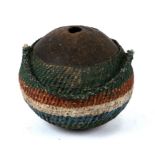 A 19th century coconut 'Bugbear' style flask with painted woven decoration, 13cms high.