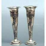 A pair of loaded silver trumpet vases