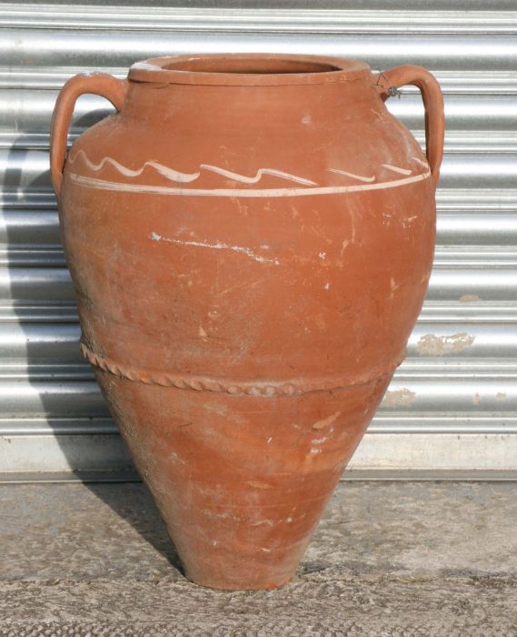 A large two handled terracotta olive jar, 56cms high.