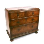 A burr walnut chest of two short and two graduated long drawers, on bun feet, 90cms wide.