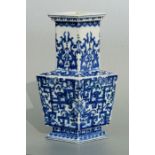 A Chinese blue & white vase of lozenge form with blue seal mark to the underside, 21cms high.