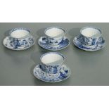 A set of four Chinese blue & white tea bowls and saucers decorated with flowers and landscape