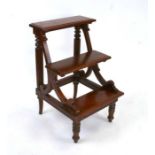 A set of George III style mahogany library steps with reeded columns and turned front legs, 52cms