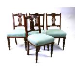 A set of four late 19th century walnut dining chairs with upholstered seats (4).