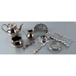 An Edwardian silver plated three-piece bachelor's tea set; together with souvenir spoons, a letter