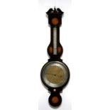 A large late 19th century barometer thermometer in an inlaid mahogany case, 114cms high.