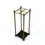 A brass four-division stick stand, 19cms wide.