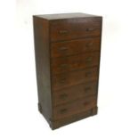 An early 20th century Hypnos oak bank of six drawers, 54cms wide.