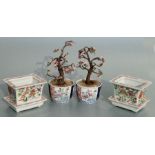 A pair of rectangular form Chinese famille rose planters on stands decorated with precious