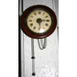 A 19th century mahogany cased postman's alarm clock, the white painted dial with Roman numerals,