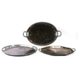A silver plated oval two-handled tray with pierced rim, 56cms wide; together with two other two-