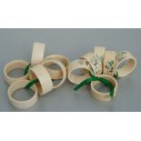 A set of six early 20th century Chinese ivory napkin rings decorated with figural scenes and