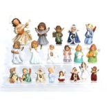 A quantity of Goebel Christmas figures to include tree ornaments and candle holders (19).