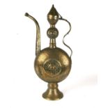 A large Turkish / Islamic brass ewer, 63cms high.