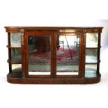 A 19th century figured walnut Credenza, the pair of mirrored doors enclosing a shelved interior
