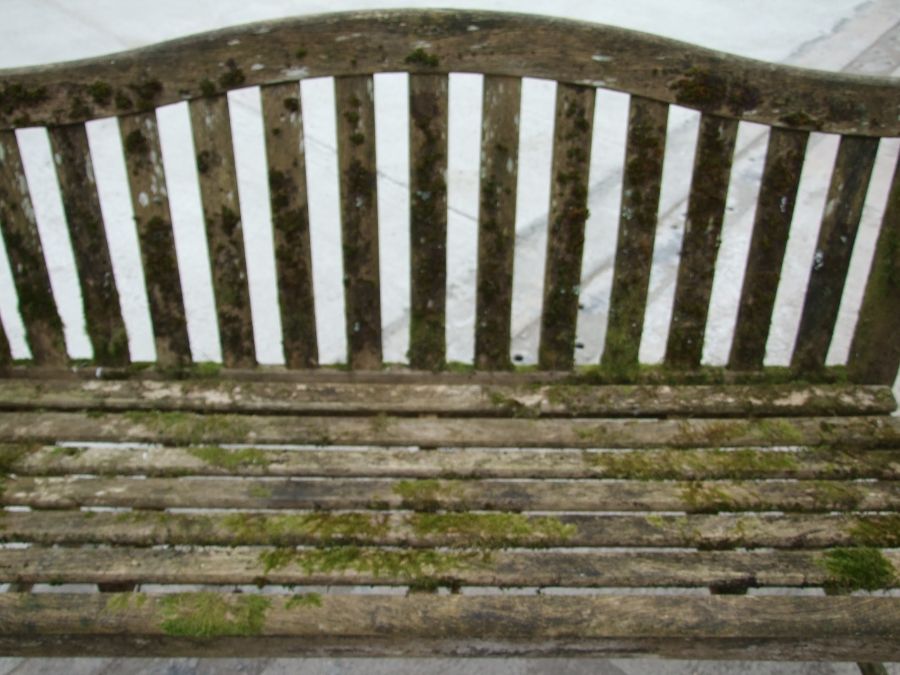 An Alexander Rose well weathered teak garden bench, 149cms wide. - Image 2 of 2