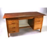 A mid 20th century Danish design pedestal desk with an arrangement of six drawers, 152cms wide.