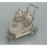 A sliver plated three-piece novelty cruet set in the form of a child's pram, 15cms long.