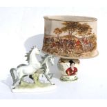 A Fieldings Crown Devon John Peel table lamp with hunting scene shade, 38cms high; and a German