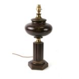 A brown crackle glaze oil lamp base with gilt monogram, converted for electricity, 45cms high.