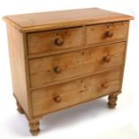 A Victorian stripped pine chest of two short and two graduated long drawers, on turned legs, 89cms