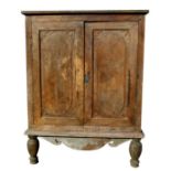 A large Asian hardwood two door cupboard on turned front legs