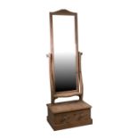 A stripped pine Cheval mirror, the rectangular plate above a single frieze drawer, on a plinth base,