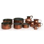 A graduated set of five copper saucepans, the largest 20cms diameter; together with assorted