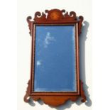 A George II style mahogany fretwork wall mirror with bevelled edged rectangular plate, 40cms wide.