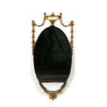 An Adams style gilt metal framed wall mirror, 41cms wide.