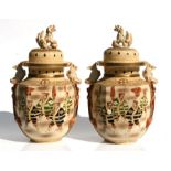 A pair of late 19th / early 20th century Japanese Satsuma temple vases decorated with figures,