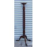 A 19th century mahogany torchere on turned column and tripod base. (a/f)