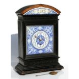 A 19th century mantle clock, the blue & white enamel dial with Arabic numerals, in a dome topped