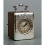 A silver mounted oak cased carriage time piece, Birmingham 1905, 11cms high.