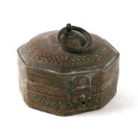 An Indian pierced brass four-division spice box of octagonal form, 14cms wide.