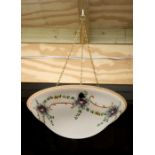 An early 20th century opaline style glass ceiling light decorated with flowers, 36cms diameter.