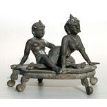 An Asian bronze erotic group, 20cms wide.