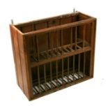 A pitch pine wall mounted plate rack, 67cms wide.