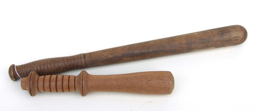 An early 20th century Police truncheon 45cms (17.75ins) long together with a short weighted cosh