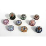 A collection of nine paperweights to include Strathern and Caithness millefiori examples (9).