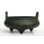 A Chinese bronze two-handled censer on tripod legs, six character mark to the underside, 16cms