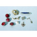 An Art Nouveau Ruskin style silver brooch with central blue cabochon; together with a quantity of