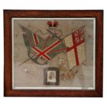 A WW1 HMS Russell embroidery with inset photograph of 217775 Able Seaman Charles Hewitt who died