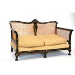 A late Victorian Bergere two-seater sofa with chinoiserie decoration, 145cms wide.Condition